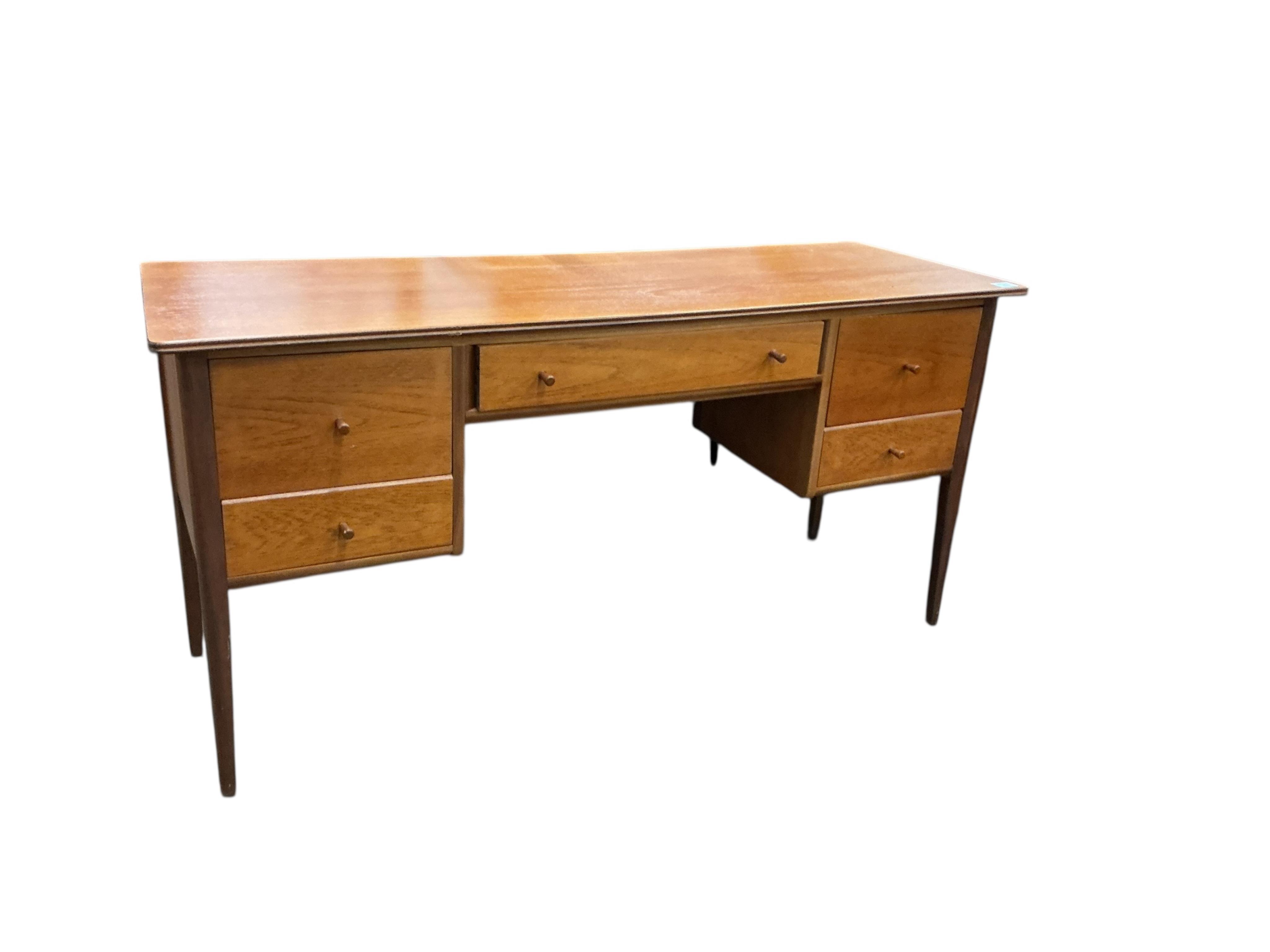 A mid century teak kneehole five drawer dressing table, width 151cm, depth 50cm, height 74cm